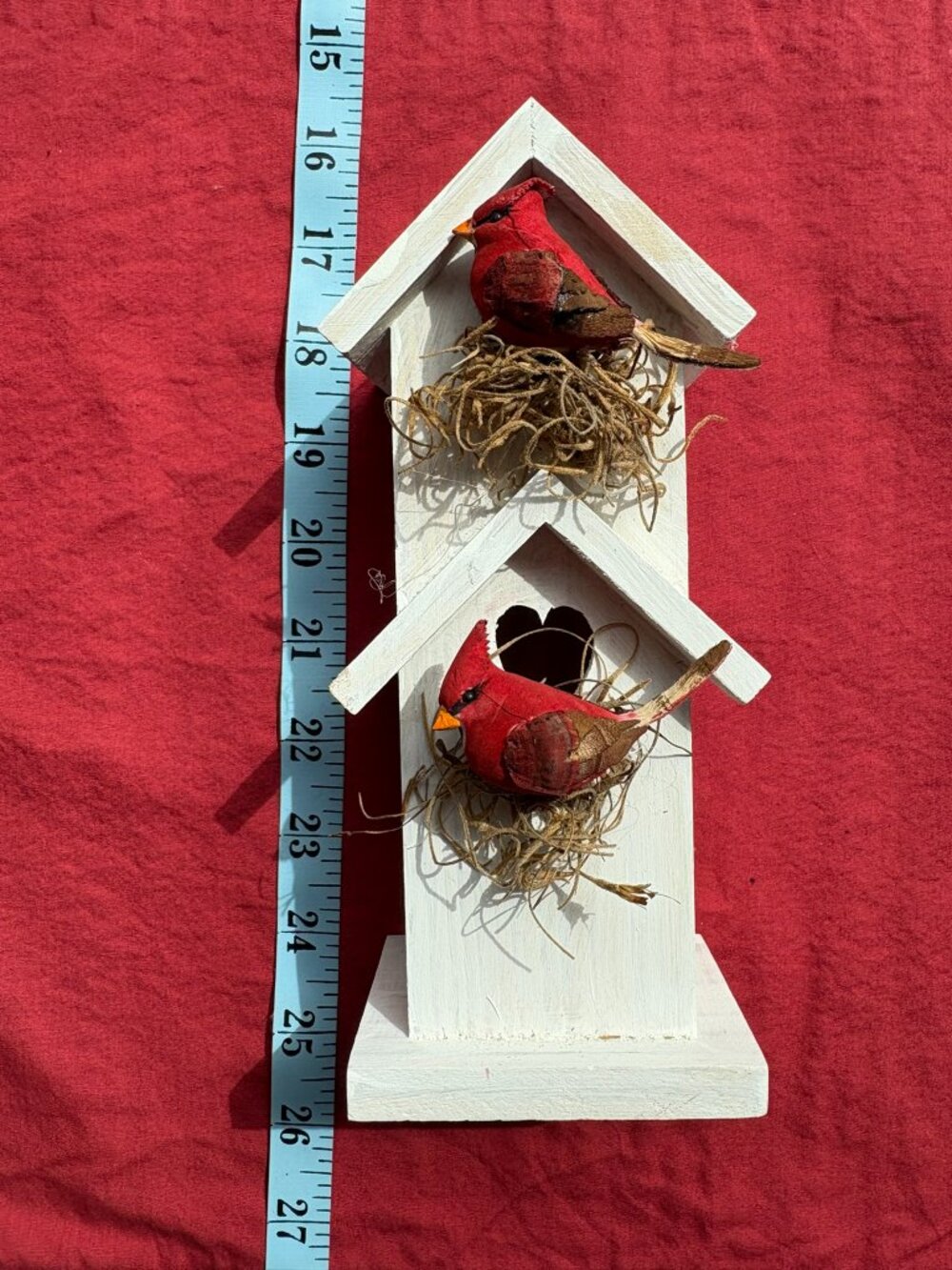 White wooden decorative birdhouse with 2 cardinals